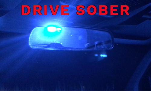 Drive sober - police lights in mirror