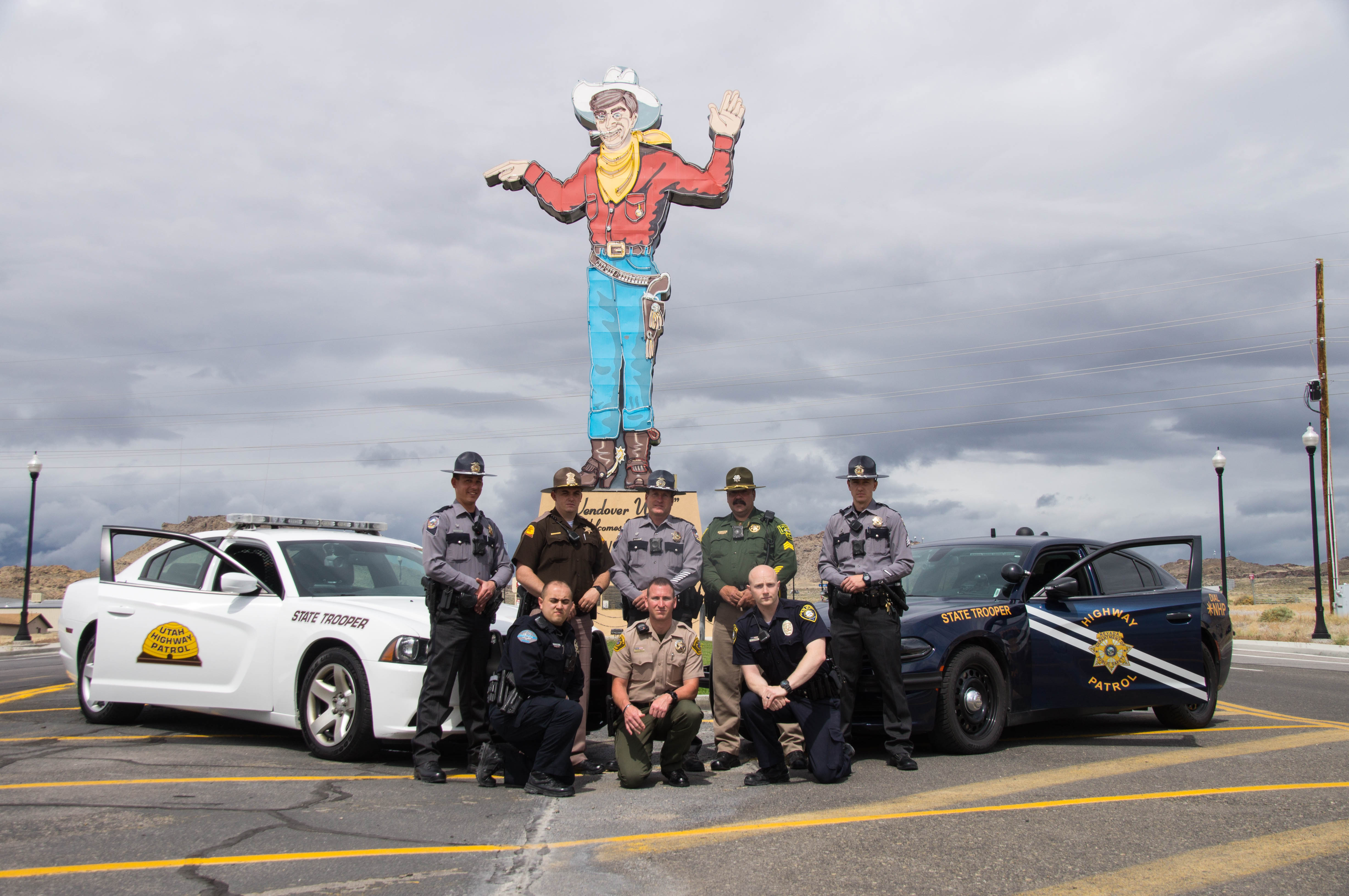 Officers from the Elko County Sheriff's Office, West Wendover Police Department, Nevada Highway Patrol, Utah Highway Patrol, Wendover Police Department and Tooele County Sheriff's Office will be participating in the Border to Border seat belt enforcement operation. Here they pose in front of the Wendover Will neon sign.