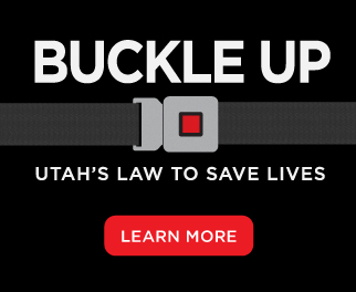 Button with "Buckle Up - click to learn more about Utah's seat belt law"