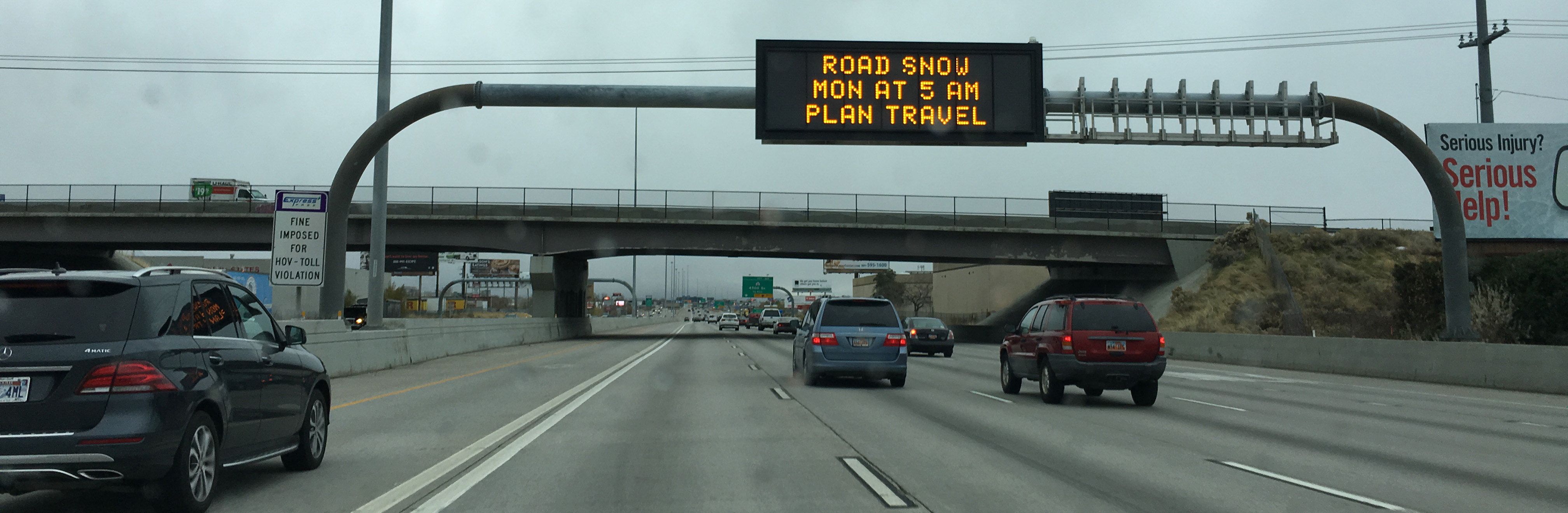 UDOT VMS sign showing "Road snow Mon at 5 am plan travel"