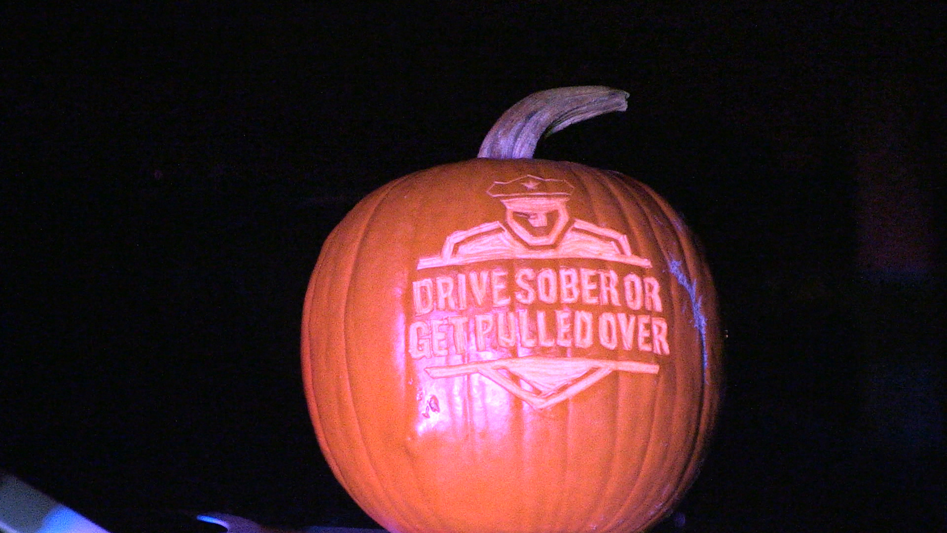 Pumpkin is carved with the Drive Sober or Get Pulled Over Logo