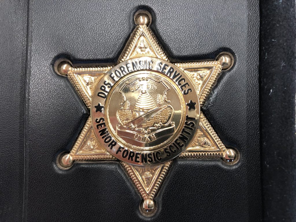 DPS Forensic Services employees are issued badges.