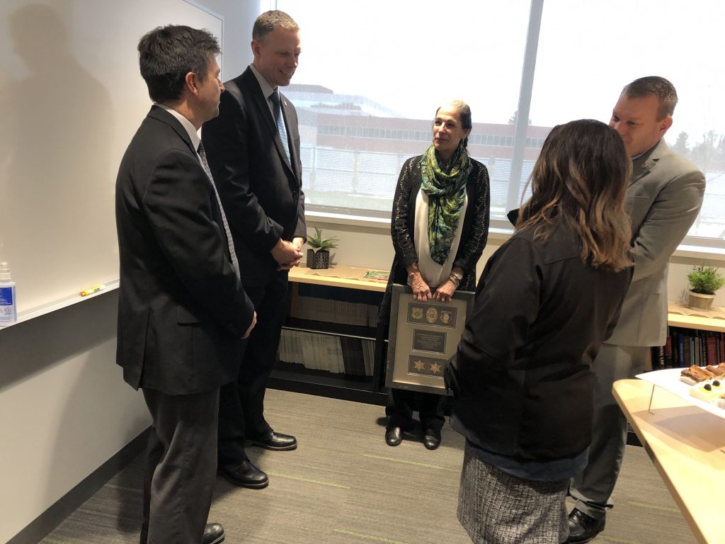 Jay Henry, Commissioner Anderson, Pilar Shortsleeve, Deputy Commissioner Higgs and Amy Lightfoot talk at Pilar's retirement reception.