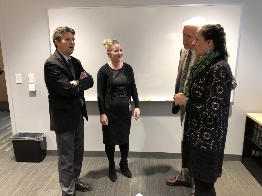 Jay Henry, Jennifer McNair, Rich Townsend and Pilar Shortsleeve talk at her retirement reception