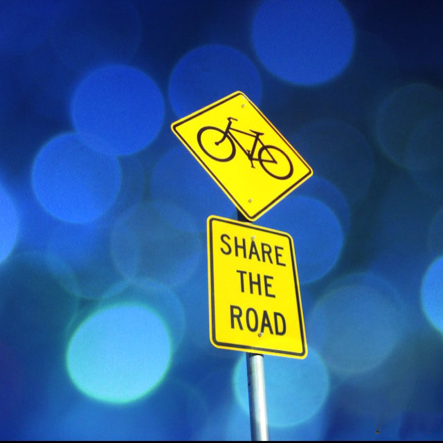 Share the road with bicycles sign.