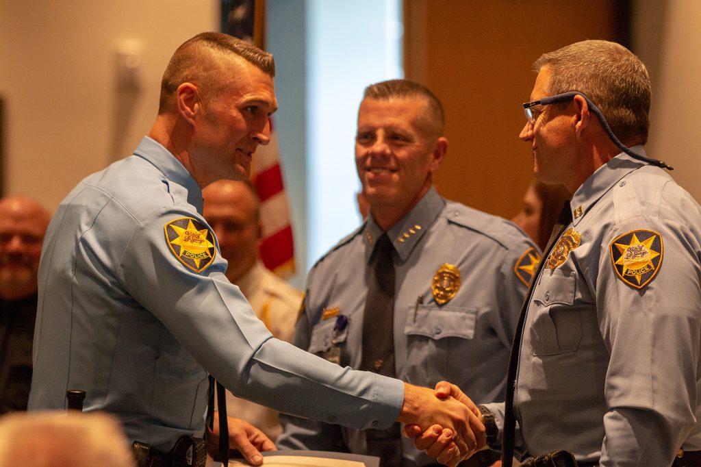 New St. George PD officer shakes the chief's hand