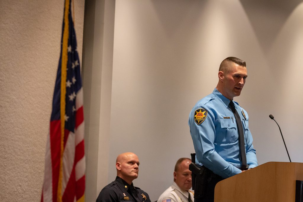 Officer Lemke delivers the class response from the podium