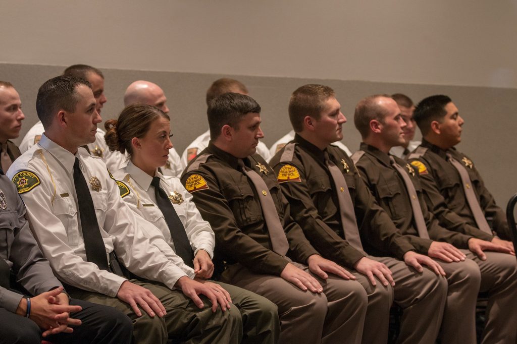 Utah County SO and UHP troopers listen to speakers at the graduation