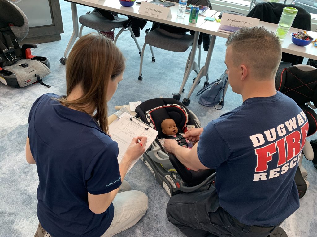 CPS instructor reviews the choice and fit of seat with a student.